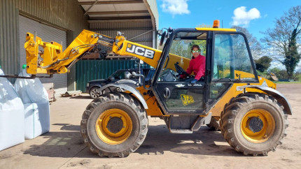 Farmer Suzi in a tractor