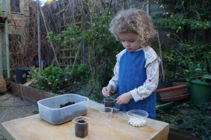 Child planting seed