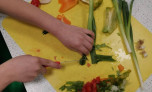 A child cutting vegetables 