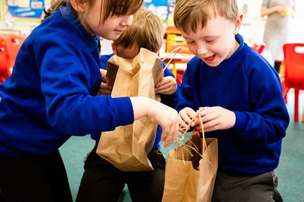 children explore the 'feely bags' from Farm in a Box