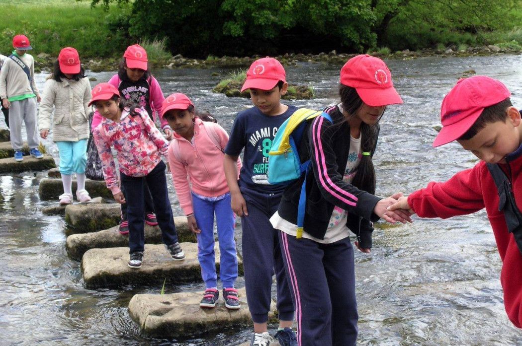 Children crossing a river